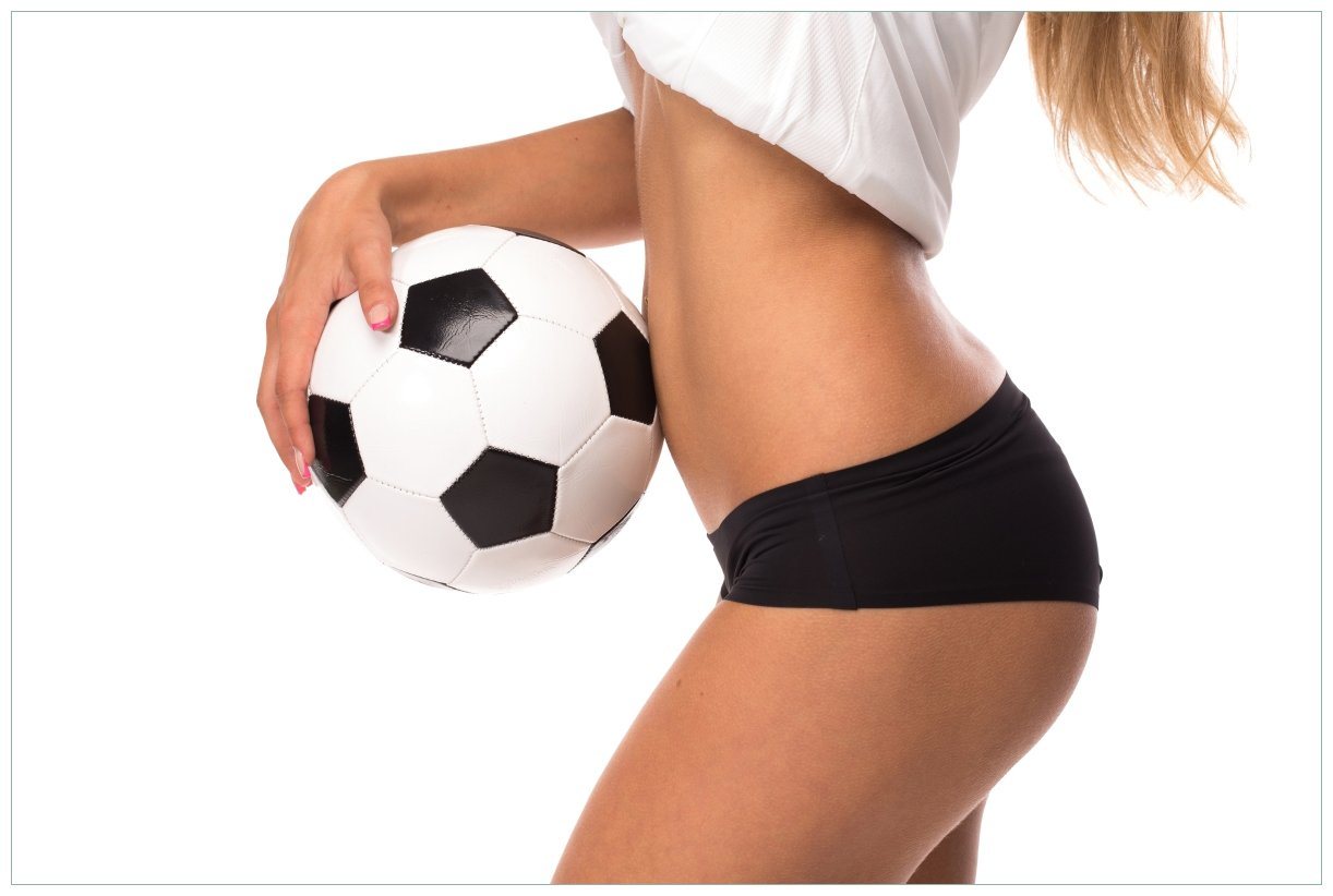 Wallario Acrylglasbild, Fußball - sexy Frau mit einem Fußball, in verschiedenen Ausführungen von Wallario