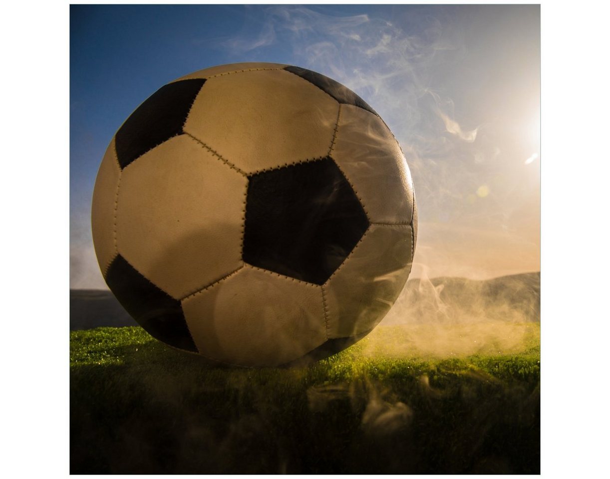 Wallario Glasbild, Fußball bei Sonnenuntergang, in verschiedenen Ausführungen von Wallario