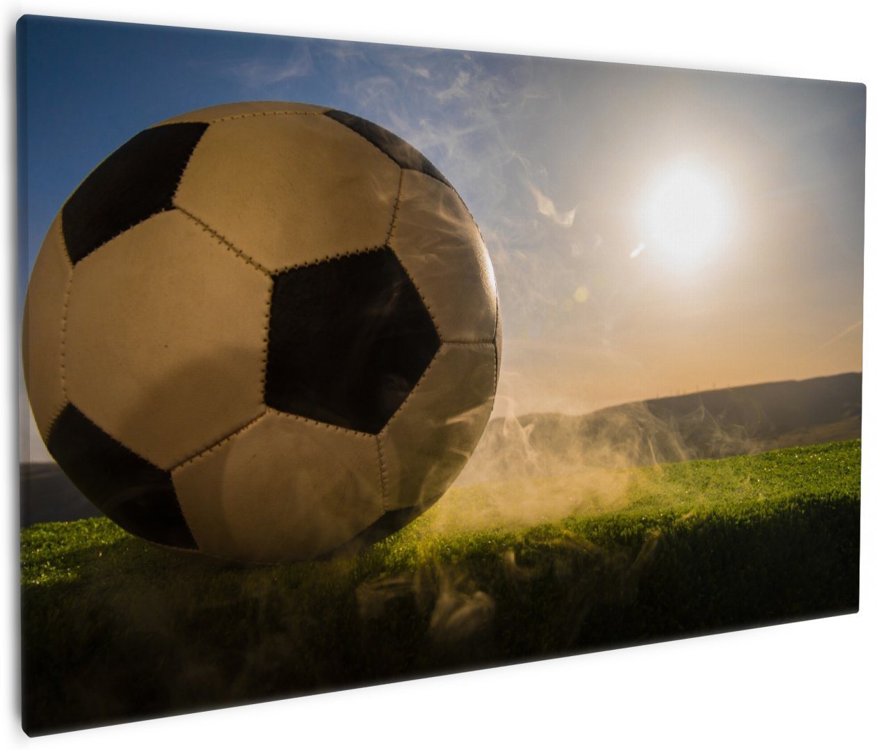 Wallario Leinwandbild, Fußball bei Sonnenuntergang, in verschiedenen Ausführungen von Wallario